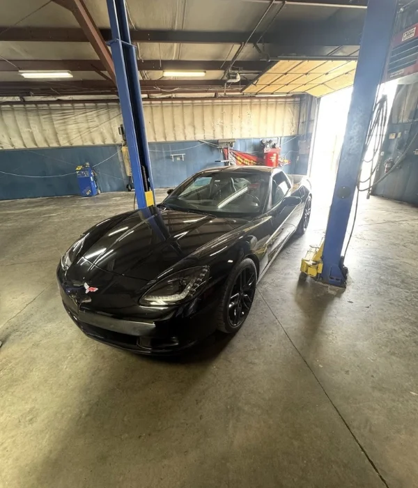 Sports car on a lift during a pre-purchase inspection