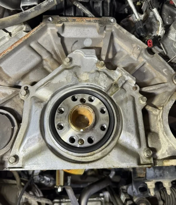 Rear of a diesel engine showing the rear main and harmonic balancer