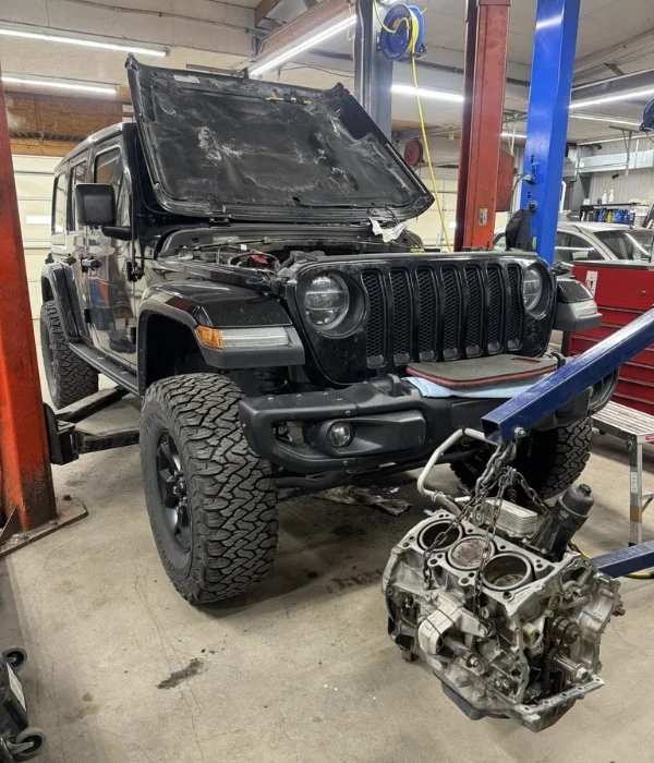 Engine pulled for replacement at Total Turf & Auto in Topeka, KS